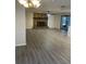 Spacious living room with a stone fireplace and modern flooring at 186 Dan River Dr, Spring Hill, FL 34606