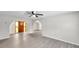 Open concept living space featuring neutral walls, new flooring and decorative doors at 186 Dan River Dr, Spring Hill, FL 34606