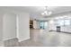 Open-concept living space with hardwood floors, access to kitchen and views of outdoor area at 186 Dan River Dr, Spring Hill, FL 34606