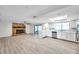 Open-concept living space featuring stone fireplace, and a modern, renovated kitchen at 186 Dan River Dr, Spring Hill, FL 34606