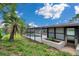 Enclosed pool is attached to the house on the back side along with a maintained yard area at 186 Dan River Dr, Spring Hill, FL 34606