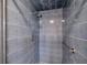 Tiled shower featuring a shower head and grab bar at 186 Dan River Dr, Spring Hill, FL 34606