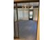 Sun room with textured walls, concrete flooring and sliding glass door at 186 Dan River Dr, Spring Hill, FL 34606