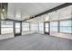 A large sunroom with carpeted floors, multiple windows, and a high ceiling at 186 Dan River Dr, Spring Hill, FL 34606