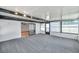 A bright sunroom featuring carpet floors, windows and a sliding glass door at 186 Dan River Dr, Spring Hill, FL 34606