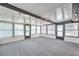 Spacious sunroom with multiple windows, carpet floors and recessed lighting at 186 Dan River Dr, Spring Hill, FL 34606