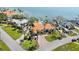 Aerial view of a house with a tile roof, circular drive, manicured lawn, and mature landscaping at 2012 Carolina Ne Cir, St Petersburg, FL 33703
