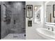 Bathroom featuring gray tile, glass enclosed shower, vessel sink and decorative artwork at 2012 Carolina Ne Cir, St Petersburg, FL 33703