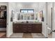 Bathroom featuring double vanity, modern lighting, and granite countertops offers ample space and elegance at 2012 Carolina Ne Cir, St Petersburg, FL 33703