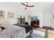 Well lit bedroom features wood floors, large window, and neutral colored walls at 2012 Carolina Ne Cir, St Petersburg, FL 33703