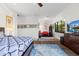 Bright bedroom featuring hardwood floors, large windows, and tasteful decor creates a relaxing retreat at 2012 Carolina Ne Cir, St Petersburg, FL 33703