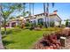 Beautiful home featuring a Spanish tile roof, lush landscaping, and a well-manicured lawn at 2012 Carolina Ne Cir, St Petersburg, FL 33703