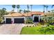 Stunning home with a three-car garage, black garage doors, and paver driveway at 2012 Carolina Ne Cir, St Petersburg, FL 33703