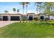 Charming home with a paver driveway, three-car garage, and well-maintained lawn at 2012 Carolina Ne Cir, St Petersburg, FL 33703