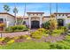 Inviting front entrance with a paver walkway, beautiful landscaping, and a dark wood front door at 2012 Carolina Ne Cir, St Petersburg, FL 33703