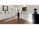 Bright hallway with hardwood floors and decorative art niches along the wall at 2012 Carolina Ne Cir, St Petersburg, FL 33703