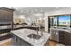 Open kitchen with a large island, stainless steel appliances, and custom cabinets at 2012 Carolina Ne Cir, St Petersburg, FL 33703
