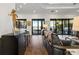Open-concept living space with bar seating, direct access to the outdoor patio, and water views at 2012 Carolina Ne Cir, St Petersburg, FL 33703