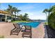 Relaxing pool area with lounge chairs, a hot tub, and scenic views of the surrounding waterfront at 2012 Carolina Ne Cir, St Petersburg, FL 33703