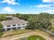 Aerial view of backyard featuring a screened-in patio and water view at 2531 Earlswood Ct, Brandon, FL 33510
