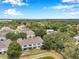 Aerial view of the back of townhomes, highlighting scenic views, screened patios, and community green space at 2531 Earlswood Ct, Brandon, FL 33510