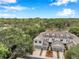 Aerial view of townhomes with a two-car garage and meticulously landscaped yards within a lush, green neighborhood at 2531 Earlswood Ct, Brandon, FL 33510