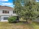 Exterior view of home featuring a screened in patio and lush backyard at 2531 Earlswood Ct, Brandon, FL 33510