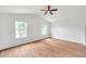 Large bedroom features two windows and hardwood flooring providing ample natural light at 2531 Earlswood Ct, Brandon, FL 33510