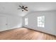 Bedroom boasts large windows, a ceiling fan, and hardwood floors at 2531 Earlswood Ct, Brandon, FL 33510