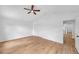 Spacious bedroom showcasing hard wood floors, ceiling fan and large closet at 2531 Earlswood Ct, Brandon, FL 33510
