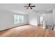 Bonus room with wood floors, large window, and ceiling fan for comfortable living at 2531 Earlswood Ct, Brandon, FL 33510
