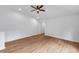 Bonus room with wood floors, recessed lighting, ceiling fan, and arched doorway at 2531 Earlswood Ct, Brandon, FL 33510