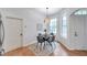 Bright dining area with stylish pendant lighting, wood floors, and views of the outdoors at 2531 Earlswood Ct, Brandon, FL 33510