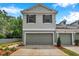 Charming two-story townhome featuring an attached garage, neutral paint, and well-manicured landscaping at 2531 Earlswood Ct, Brandon, FL 33510