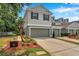 Well-maintained townhome featuring a garage, manicured landscaping, and a clean, attractive exterior at 2531 Earlswood Ct, Brandon, FL 33510