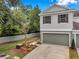 Attractive townhome featuring an attached garage, neat landscaping, and a well-maintained neutral exterior at 2531 Earlswood Ct, Brandon, FL 33510