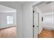 Hallway view featuring a bedroom on the left, and a bathroom on the right at 2531 Earlswood Ct, Brandon, FL 33510