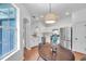 Bright and airy kitchen featuring white cabinets, stainless steel appliances, and hardwood floors at 2531 Earlswood Ct, Brandon, FL 33510