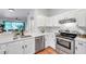 Bright kitchen features white cabinets, stainless steel appliances, and an open layout at 2531 Earlswood Ct, Brandon, FL 33510
