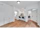 Bright living area boasts wood floors, breakfast bar, and views into the kitchen and powder room at 2531 Earlswood Ct, Brandon, FL 33510