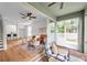 Living room leading to a screened lanai with stylish seating and backyard views at 2531 Earlswood Ct, Brandon, FL 33510