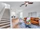 Spacious living room with staircase, breakfast bar, and comfortable seating arrangement at 2531 Earlswood Ct, Brandon, FL 33510