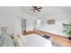 Bright bedroom with wood floors, ceiling fan, ensuite, and ample closet space at 2531 Earlswood Ct, Brandon, FL 33510