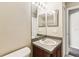 Bathroom with a single sink vanity, large mirror, and neutral walls at 256 Castlekeeper Pl, Valrico, FL 33594
