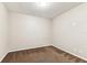 Bedroom with carpet, neutral walls, and minimal decor at 256 Castlekeeper Pl, Valrico, FL 33594