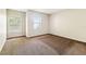 Bedroom featuring carpet floors, neutral paint and two windows at 256 Castlekeeper Pl, Valrico, FL 33594