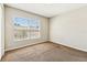 Bright bedroom with a large window and neutral walls at 256 Castlekeeper Pl, Valrico, FL 33594