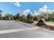Kings Mill community entrance and signage with lush landscaping on a bright, sunny day at 256 Castlekeeper Pl, Valrico, FL 33594
