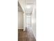 Hallway with carpet and white walls leading to other rooms at 256 Castlekeeper Pl, Valrico, FL 33594