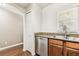 Updated kitchen with stainless steel dishwasher, granite counters, and wooden cabinets at 256 Castlekeeper Pl, Valrico, FL 33594